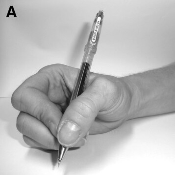 grasping a pen using the dynamic tripod grip.
