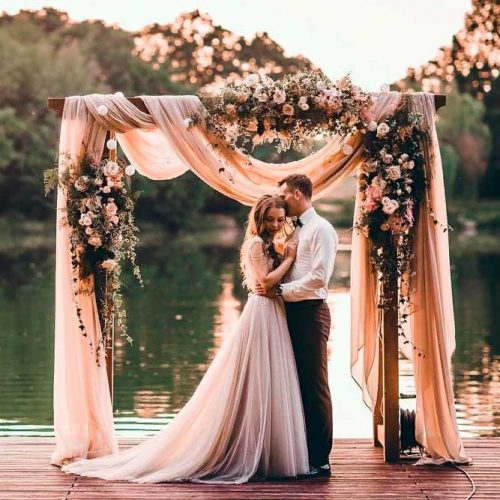 An Elegant Arch With Mixed Textures #outdoorweddingarch #weddingarchdraping