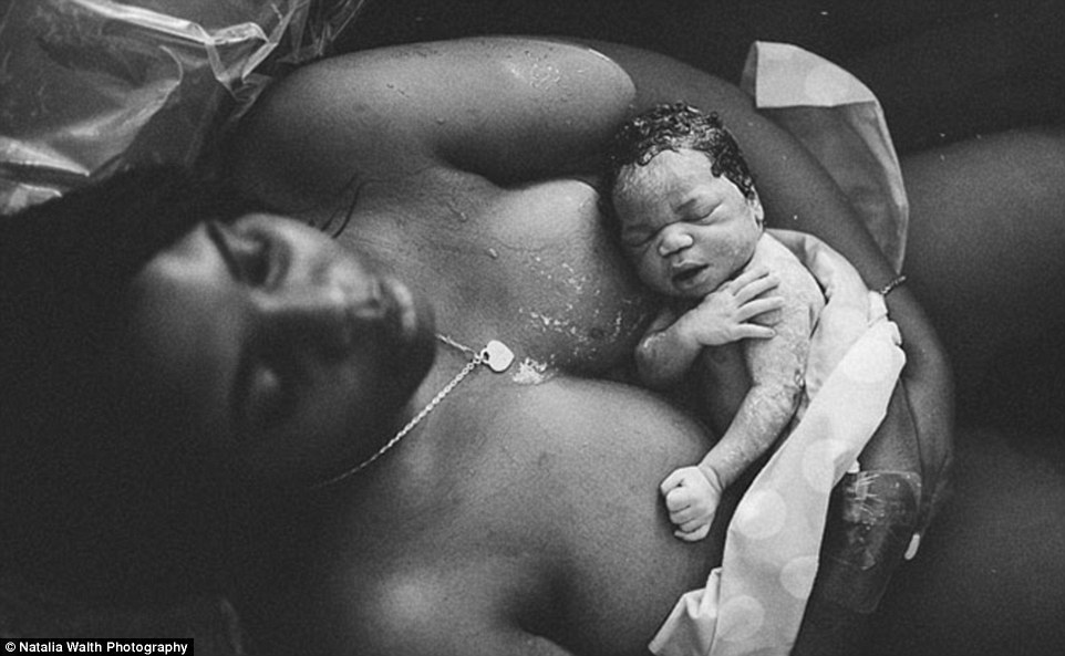 A relieved mother cradles her newborn in a black and white shot showing the serenity after birth. Photographer Nathalia Walth, from Los Angeles, called it 