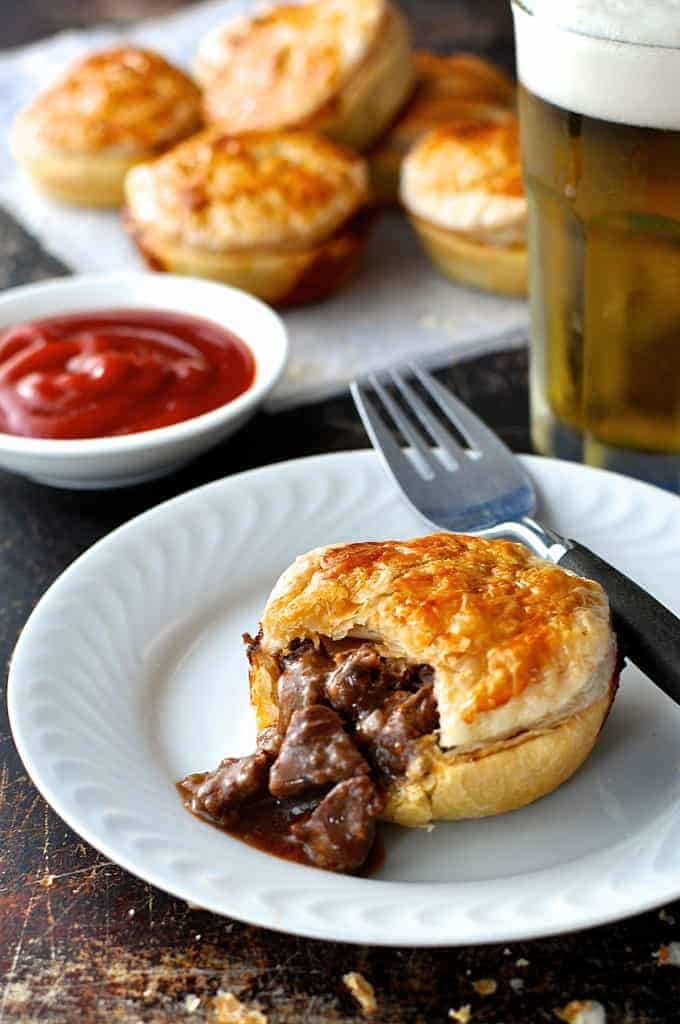 Party Pies and meat filling spilling from inside of one